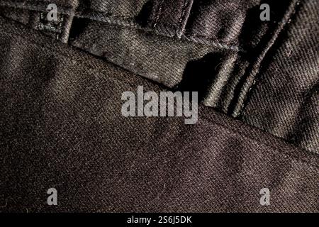 Black denim jean texture as background Stock Photo