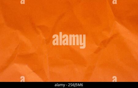 Abstract crumpled orange paper background creased texture Stock Photo