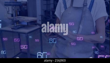 Image of 5g and 6g text and digital icons processing over caucasian woman using tablet Stock Photo