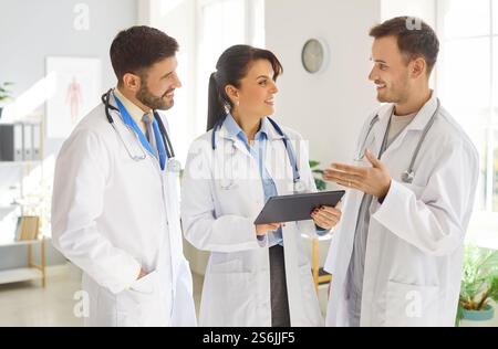 Doctors And Nurses Using Tablet Pc During Meeting Stock Photo