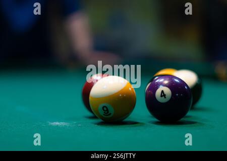 Close up background image of billiard balls on green table in pool club copy space. High quality photo Stock Photo