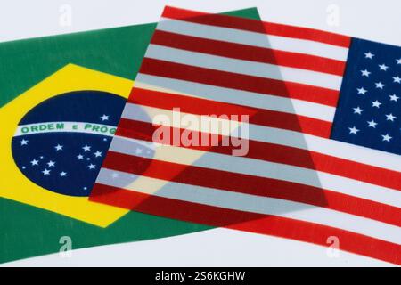 American and Brazilian flags isolated on white background. Closeup Stock Photo