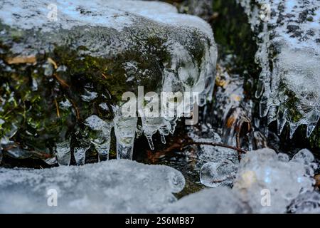 Tiny icicles covering rock at a small cascade Stock Photo
