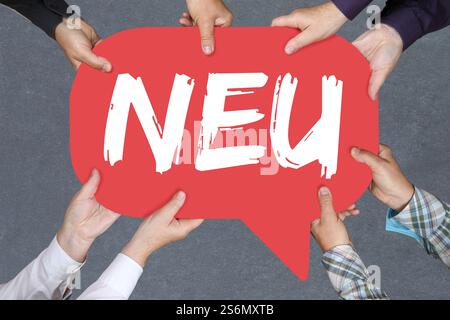 Group of people holding hands the word novelty novelty hint info information advertising business business concept Stock Photo