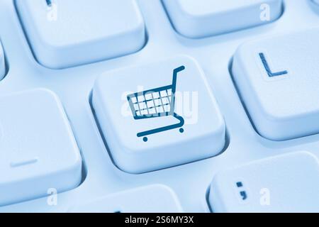 online shopping e-commerce shopping internet icon blue computer keyboard Stock Photo