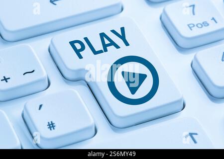 Play button press listen to music movie internet icon computer keyboard blue Stock Photo