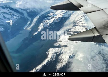 Flight over the glaciated coastal mountains in Alaska Stock Photo