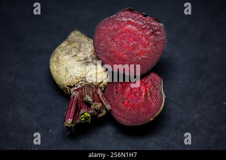 fresh raw beetroot slice close-up studio shot on black background Stock Photo