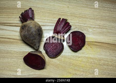 fresh raw beetroot slice close-up studio shot on wood background Stock Photo