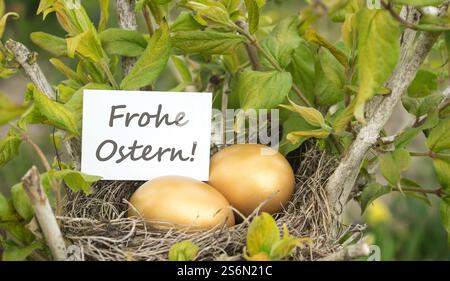 German Easter card with bird's nest and golden eggs Stock Photo
