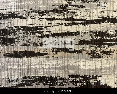 Random customized hand sewn carpet rug in shades of black, grey, and white color. Rug or carpet flooring abstract seamless texture, unique luxurious h Stock Photo