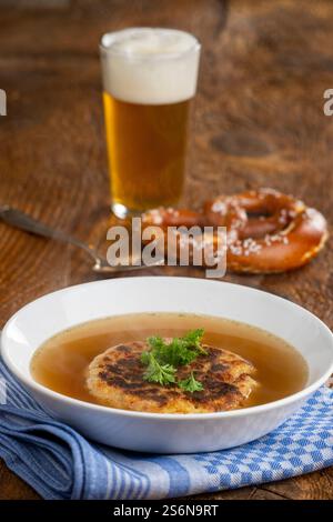 Austrian cheese dumpling soup on wood Stock Photo
