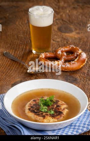 Austrian cheese dumpling soup on wood Stock Photo
