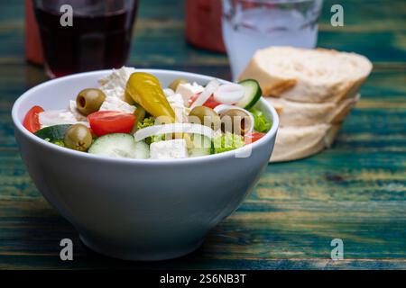 Greek salad on green wood Stock Photo