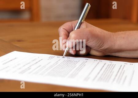 Woman fills out living will Stock Photo