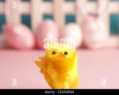 Close up of cute chick with Easter eggs background Stock Photo