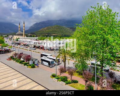 View of the old bazaar of Kemer with stores and a mosque with two minarets on the main street, Antalya, Turkey Stock Photo