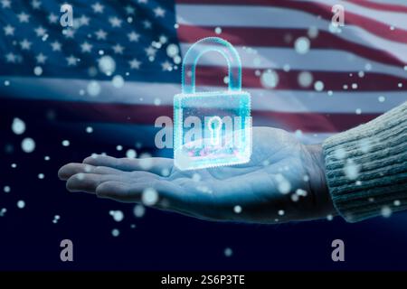 Hand holding glowing digital padlock protecting data with american flag background Stock Photo