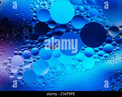 Abstract design featuring bright blue floating bubbles with a modern style and soft color transitions. Perfect as a vivid and creative background for Stock Photo