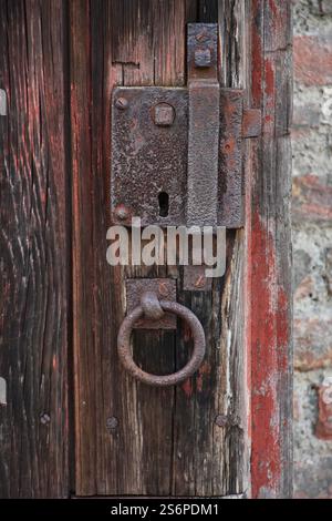 Rusted lock on a historic door Stock Photo