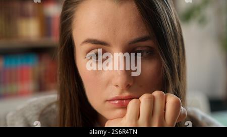 Sad thoughtful Caucasian woman thinking solution female girl businesswoman student teacher school classroom learning education upset tired lesson Stock Photo