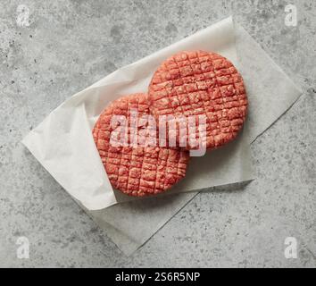 fresh raw burger meat on grey kitchen table, top view Stock Photo