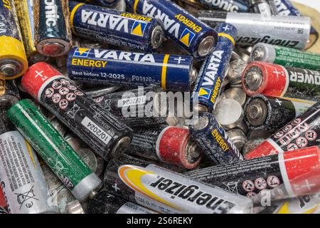 Waste batteries, used batteries, various sizes and brands, crystalline residues, detail, Stock Photo