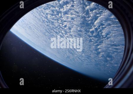 Spaceship flies near the glowing blue planet Earth, view from the window. View from space of the surface of planet Earth. Elements of this image furn Stock Photo