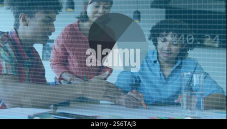 Data processing image over diverse colleagues collaborating in office Stock Photo