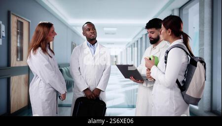 Nurse And Doctor Students Trainees Walking In Hospital Stock Photo