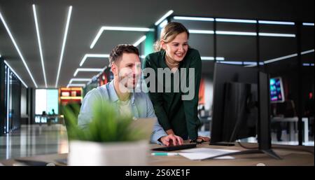 Business Data Analysts Man And Woman Using Computer Stock Photo