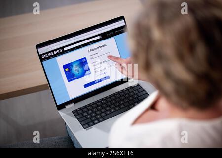 Cropped Image Of Woman Shopping Online With Credit Card And Laptop Stock Photo