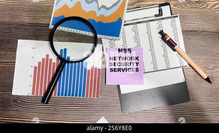 Concept of NSS - Network Security Services write on sticky notes isolated on Wooden Table. Stock Photo