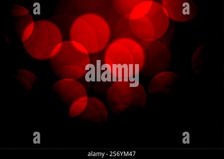 red bokeh background with defocused lights Stock Vector