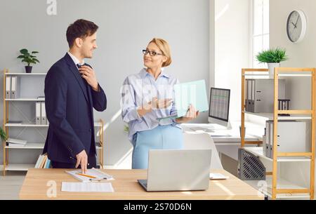 Colleagues Collaborating On Business Accounting In Office Stock Photo