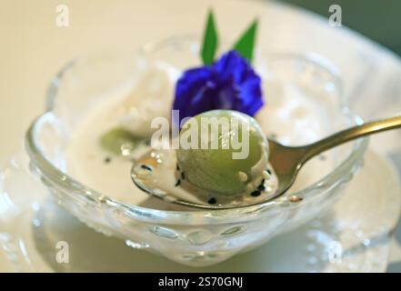 Closeup of Khanom Kho Kati, Delicious Thai Southern Coconut Dumplings in Sweetened Coconut Milk Stock Photo