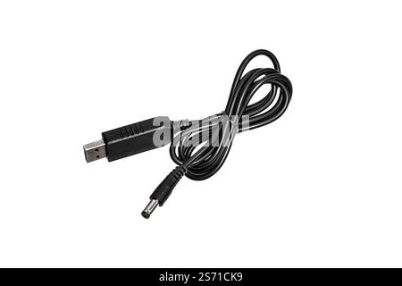 A black USB to DC power cable, isolated on a white background, showing both connectors clearly, useful for charging or powering various electronic dev Stock Photo