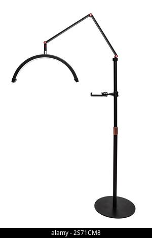 A sleek black floor lamp with an adjustable arm and curved LED light, perfect for modern interiors. Stock Photo