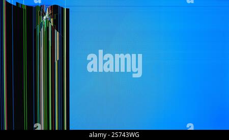 A broken screen with colorful vertical lines and digital artifacts on a blue background. An abstract image of destruction and technological malfunctio Stock Photo