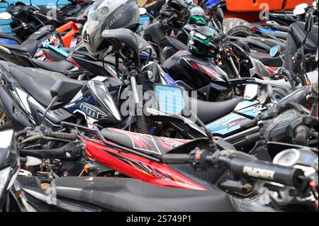 A pile of motorbikes in Roatan, Honduras Stock Photo