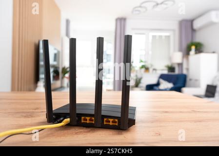 Black wifi router with four antennas. Fast wireless network concept Stock Photo
