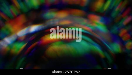 Defocused rainbow lens. Strobe effect. Bright overflows color festive luminosity turning source light. Rounded distortion vision. Extinction rays illumination. Stock Photo