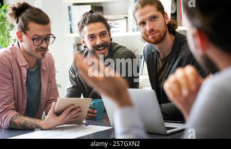Happy software developers working on meeting, Programming advanced code artificial intelligence. Stock Photo