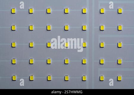 White LED panel with yellow light on background, top view, close up Stock Photo