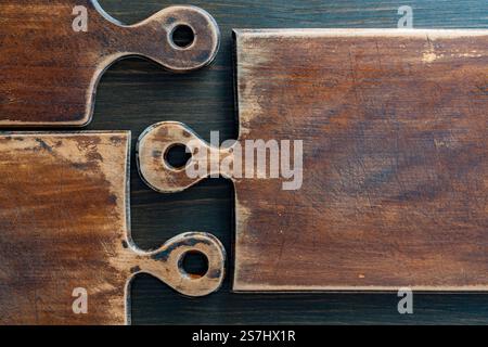 Three old retro cutting boards of various shapes on wooden background, close up Stock Photo