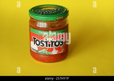 Tostitos Chunky Salsa jar on a yellow background Stock Photo