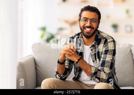 Handsome middle-eastern millennial man posing at home Stock Photo