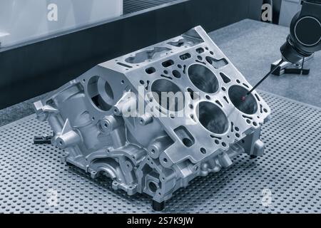 Quality control on milling CNC machine, coordinate measuring machine, Quality control machine. cylinder block of diesel engine repair. Stock Photo
