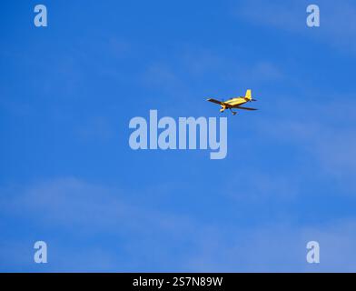 Sedona, Az, USA - 19 Jan 2025 - A yellow airplane on a blue sky Stock Photo
