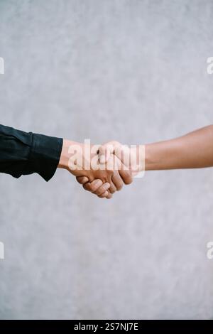 Two people shaking hands in agreement. Stock Photo